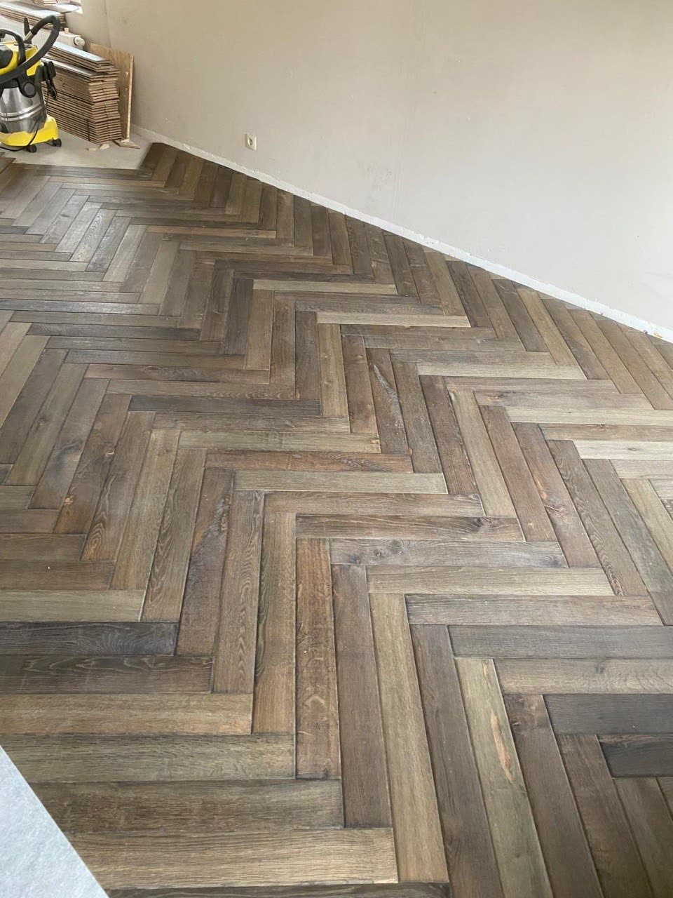 Visgraatparket in eik — VDC Construct, Brugge